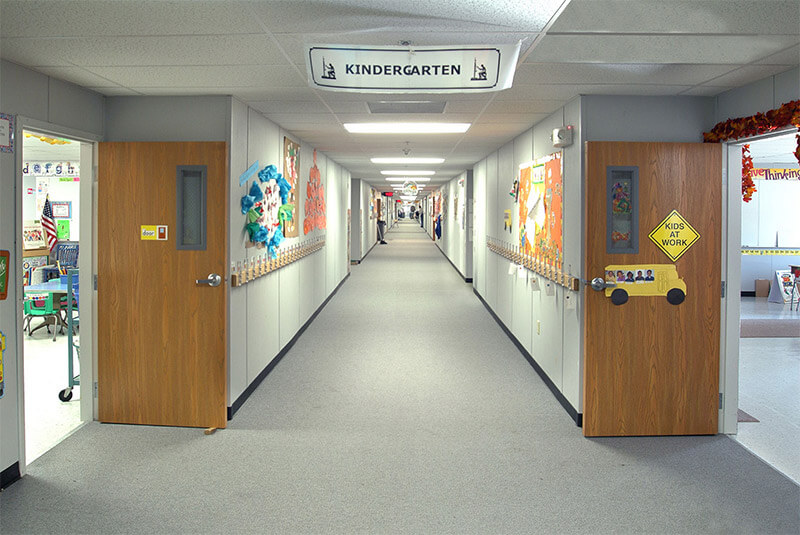 Innovative Modular Classroom hallway with decorated doors in Pedricktown, NJ