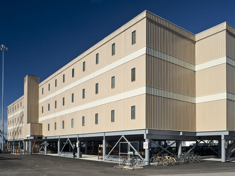 Multi-story government institution building with parking spaces located in Pedricktown, NJ