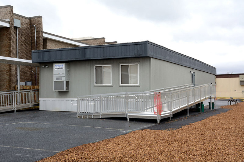 Innovative Modular Classroom featuring a ramp and a parking lot for accessibility in Pedricktown, NJ