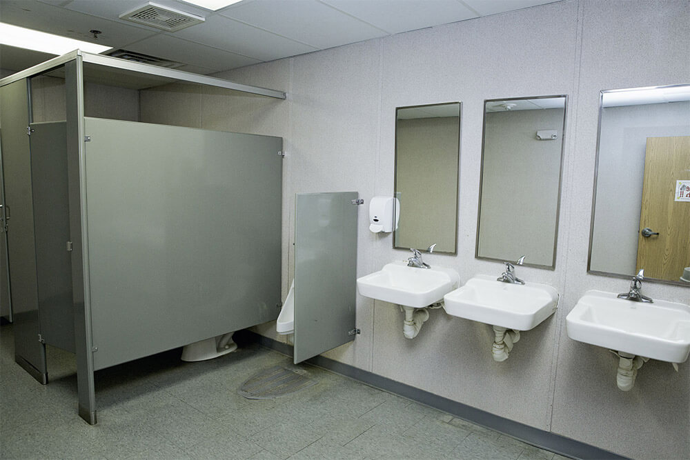 Flexspace bathroom featuring three sinks and a urinal for convenience in Pedricktown, NJ