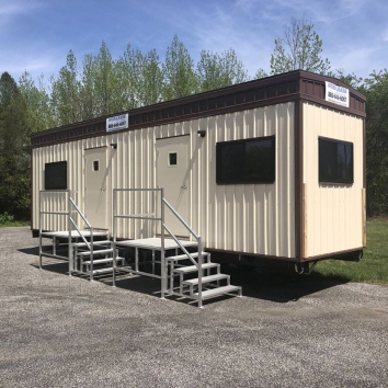 Mobile office trailers with two entrances and metal stair access parked in Pedricktown, NJ