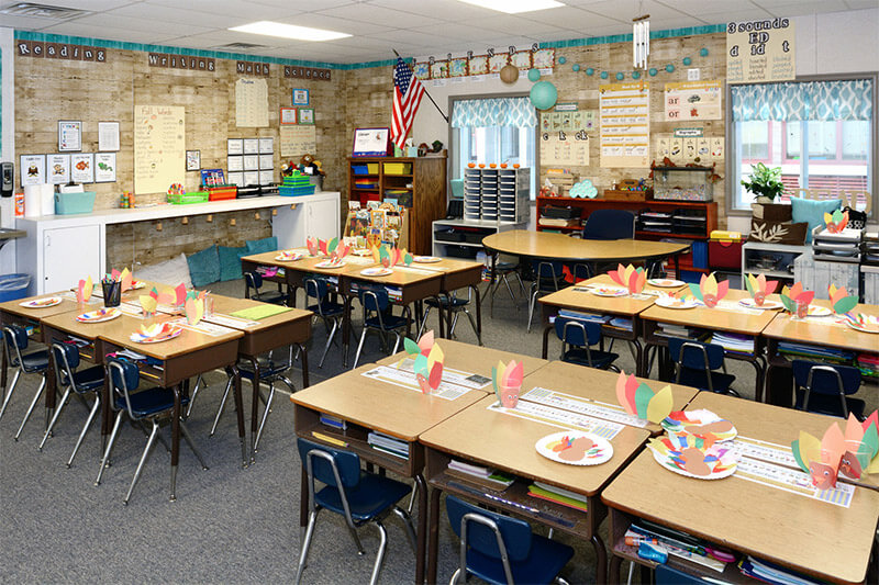 Elementary modular classroom with decorated student desks, colorful crafts in Pedricktown, NJ