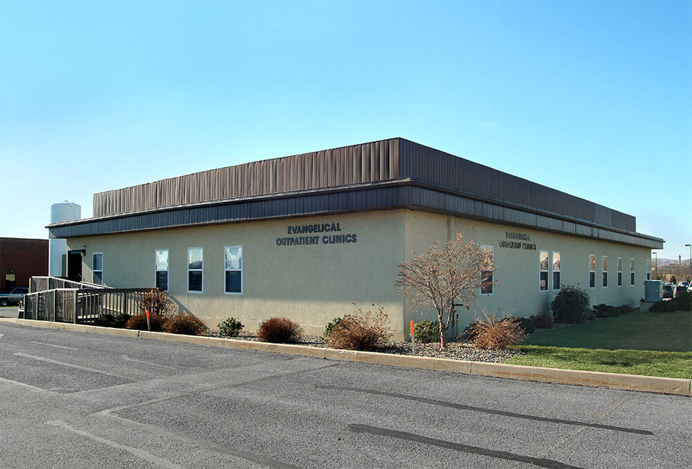 Single-story modular healthcare space with beige exterior, metal roof & ramp in Pedricktown, NJ
