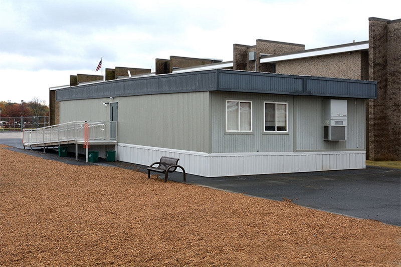 Classroom Modular building by Mobilease Modular Space with ramp and bench seating